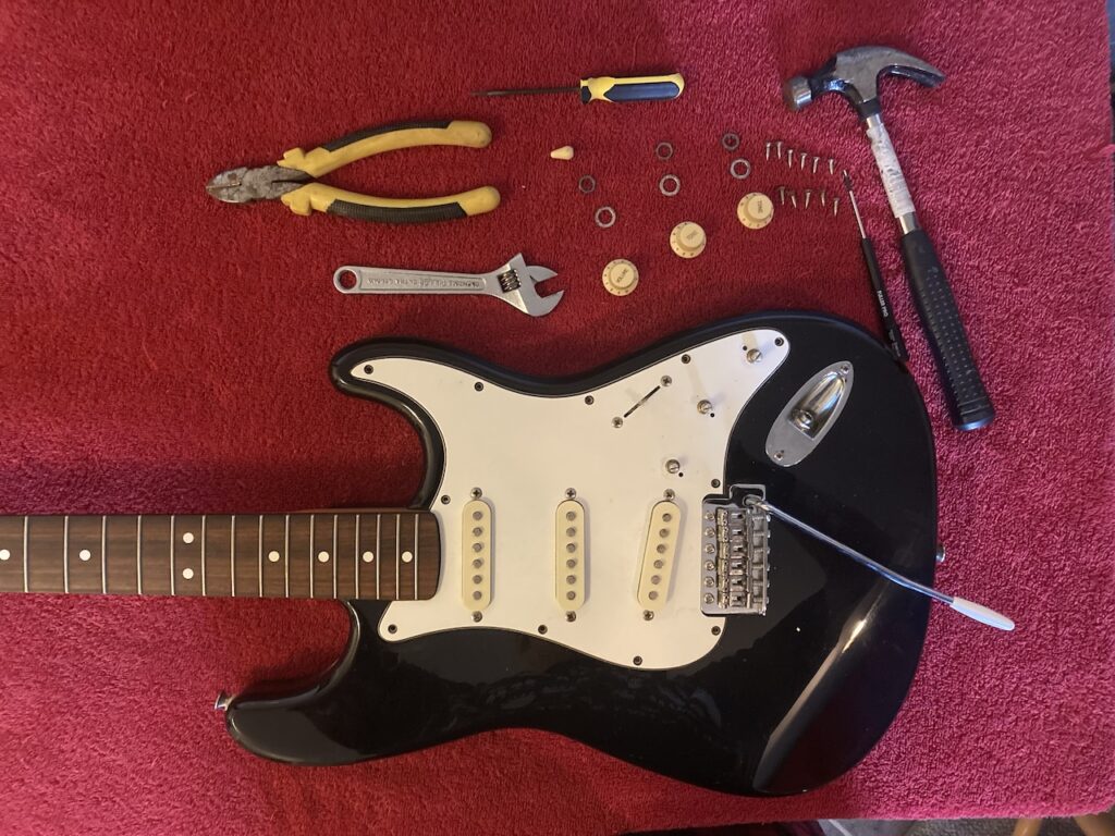 body of Stratocaster with the pick-guard screws removed