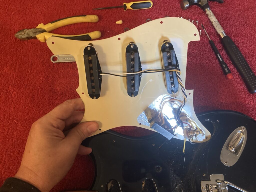 Body of the Stratocaster with the pick-guard lifted away