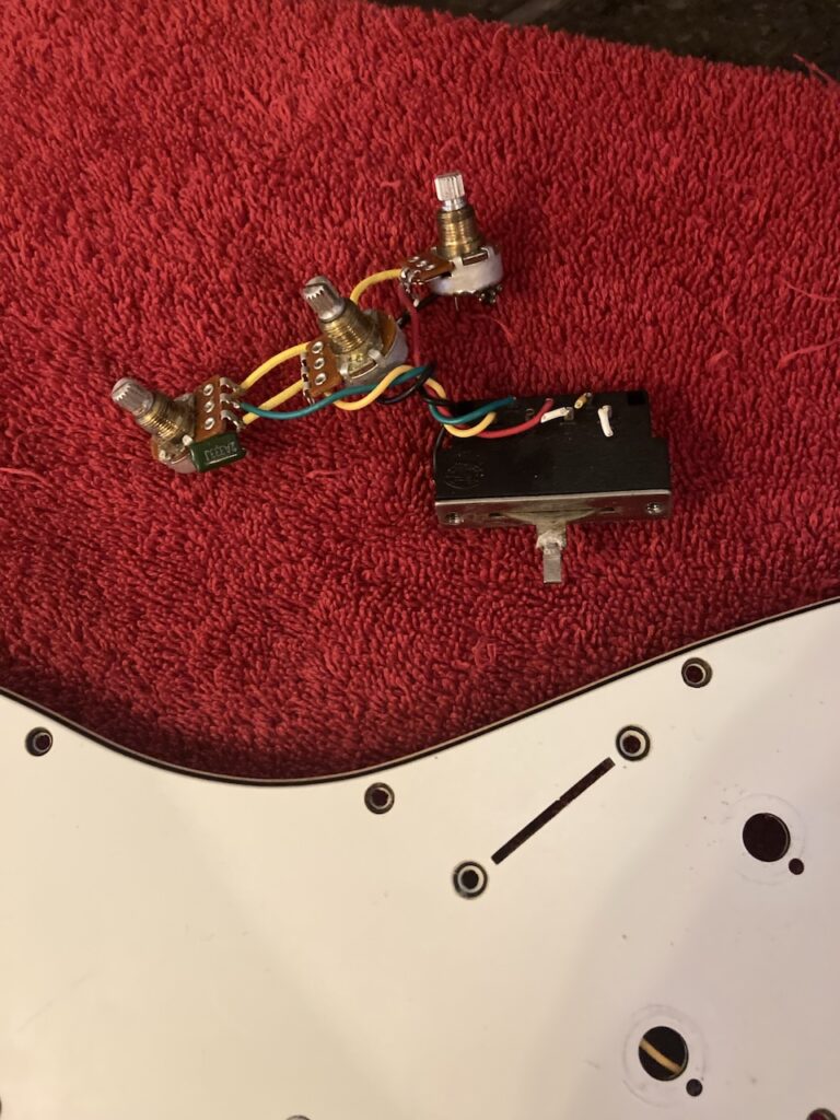 The three original potentiometers and selector switch, removed
