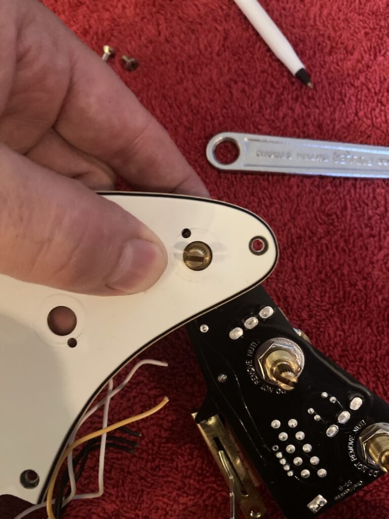 Fitting a new potentiometer shaft through an old hole reveals that the fit is too tight