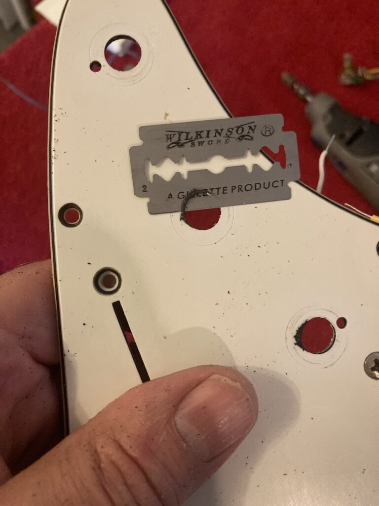 Removing the burrs with a razor blade